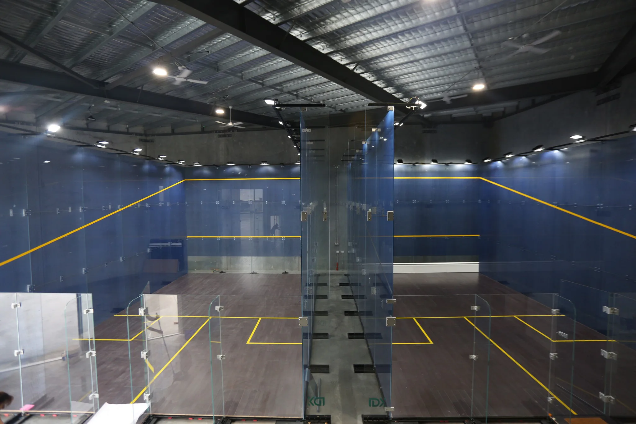 Close view of a finished blue squash court