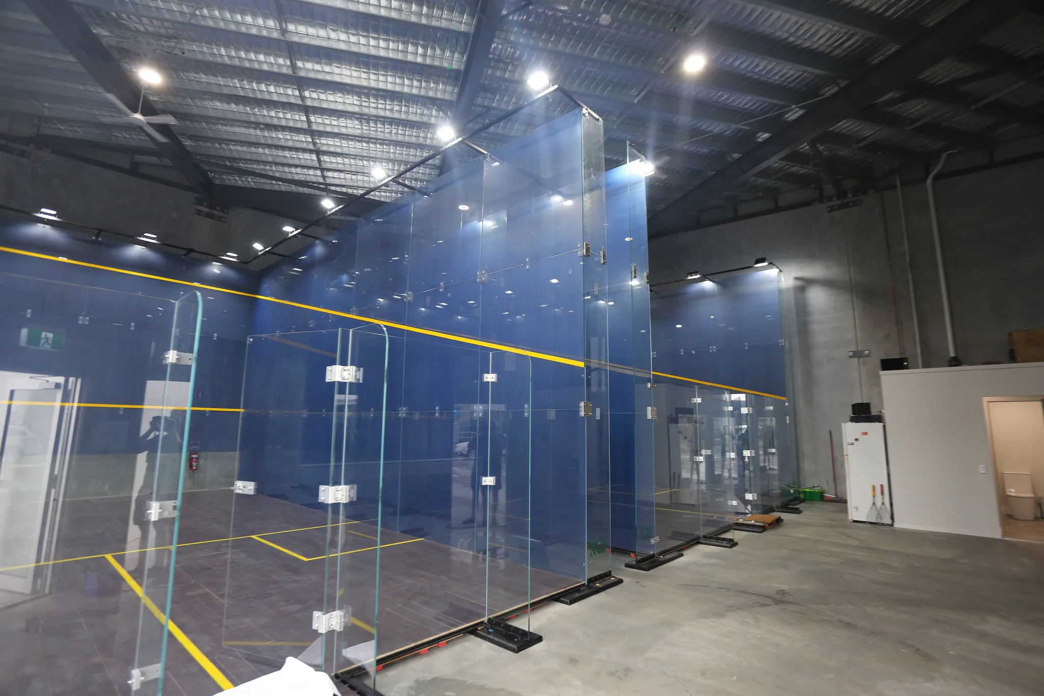 Side view of multiple squash courts